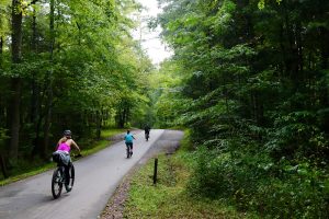 Bikers enjoy the popular Cades Cove Loop Road. On Wednesdays in the summer (this year June 18 to September 24), cars are not allowed so as to give cyclists and pedestrians a more pleasant experience. Photo by Carter Rutledge.