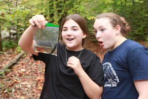 Students from T. W. Hunter Middle School north of Nashville in Hendersonville, Tennessee, marvel at a salamander found in a stream on Tremont’s campus. Photo by Erin Rosalina, courtesy of Great Smoky Mountains Institute at Tremont. 