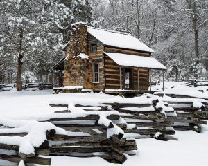 John Oliver Cabin is only a 20-minute walk from the Cades Cove Loop Road gate. Snow comes off the branches and rails quickly, so be aware. The snow-covered rails add foreground interest and give the composition depth. Photo by Nye Simmons.
