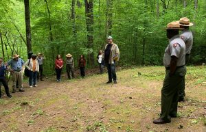 Eric Mingus speaks at a musical performance at Enloe Slave Cemetery near Mingus Mill in the Smokies. Like his late father, Eric is an ac¬¬¬complished bassist, and his work often confronts social and racial issues in America. Provided by Great Smoky Mountains Association.