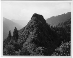 View of the Smokies’ Chimney Tops landmark circa 1920. This photo, presumed to be by George Masa, was colored and used as a post card by Asheville Post Card Company. Courtesy of Horace Kephart Family Collection, GSMA