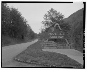 The Walland-to-Look Rock section of the Foothills Parkway opened to a line of waiting vehicles at 8 a.m. on September 3, 1965, and the Look Rock campground and picnic area opened the following day. The parkway, campground, and picnic area were all constructed with funds from the Mission 66 effort to improve park infrastructure around the 50th anniversary of the NPS. Photo of parkway entrance soon after it opened provided by Library of Congress.
