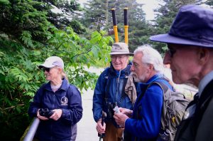 The group watches a family of dark-eyed juncos search for seeds under the tower at Clingmans Dome. Photo provided by Holly Kays, Smokies Life. 