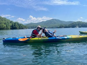 Program participant Matthew Shelton (right) uses an adaptive kayak with his mother Sharon Shelton on Fontana Lake during a group outing in Great Smoky Mountains National Park. Photo provided by Catalyst Sports. 