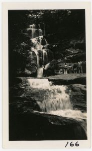 Hikers stare up at Ramsey Cascades, the tallest waterfall in Great Smoky Mountains National Park, in a photo taken by Carlos C. Campbell on June 23, 1934, one week after the park’s creation. Photo provided by GSMNP archives. 