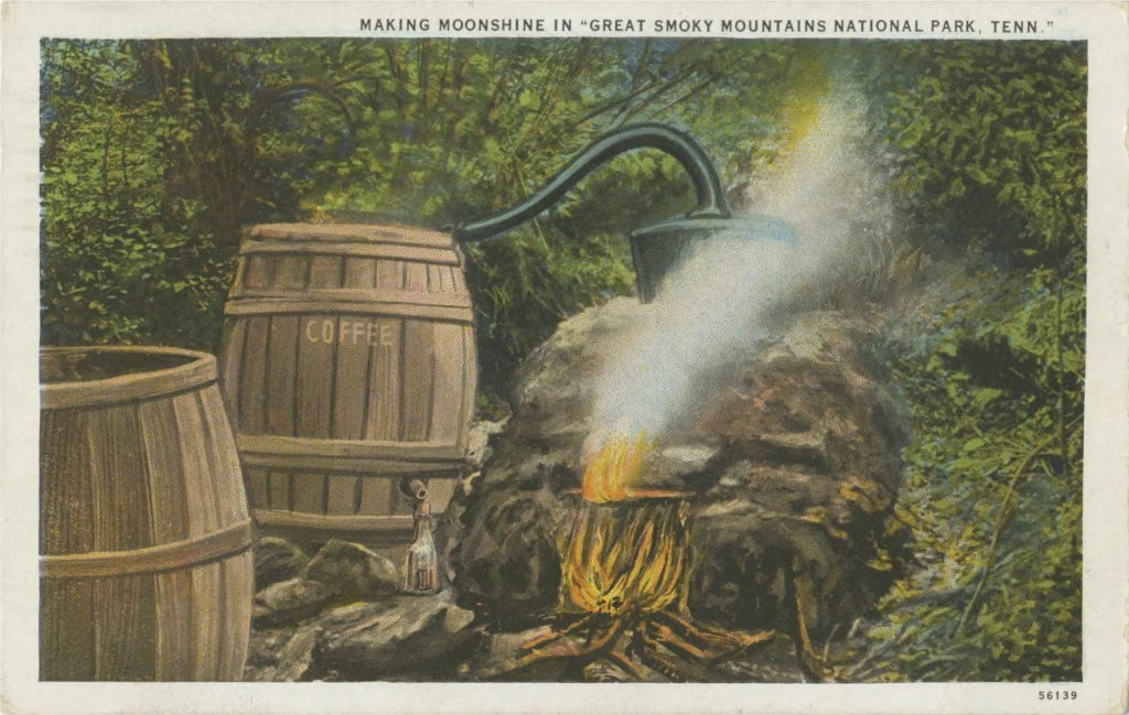 A postcard produced in Knoxville depicts “Making moonshine in ‘Great Smoky Mountains National Park, Tenn.’” The practice of illegal whiskey production flourished in the remote valleys of the Smokies prior to the creation of the national park and remained central to the park’s lore long after the stills were moved, confiscated, or destroyed. Image provided by University of Tennessee, Knoxville, Special Collections.