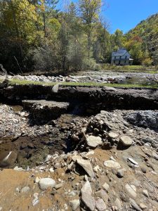 The Hiram Caldwell House looks out over a road rendered impassable following major flooding on Rough Fork Creek. Cataloochee Valley is closed until further notice. Photo provided by National Park Service. 