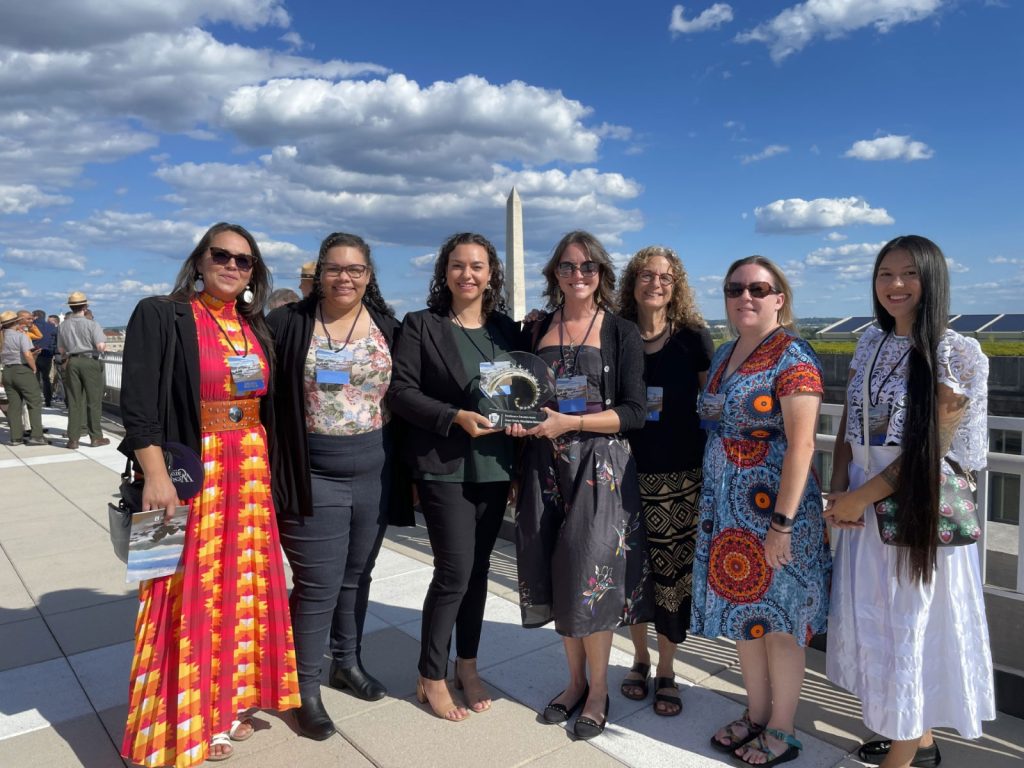 The Seeking Paths in Nature curriculum earned the 2023 Excellence in Education Award from the National Park Service, presented on August 21 in Washington, DC. Pictured after accepting the award are (from left) Malia Crowe Skulski, Natrieifia Miller, Kaylyn Barnes, Callia Johnson, Susan Sachs, Beth Wright, and Kahawis. Photo provided by Smokies Life.