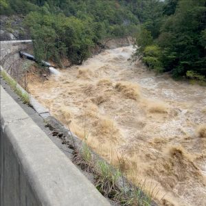 Even after peak flooding from Hurricane Helene subsided, the Pigeon River continued to rage alongside a decimated I-40. Photo provided by NCDOT. 