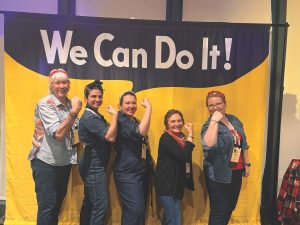 Rematore (second from right) enjoys a lighthearted moment with Smokies Life staff at the 2024 Public Lands Alliance Convention. During her time at Smokies Life, Rematore has spurred the organization to become a leader in this nationwide network of public lands nonprofits. Photo provided by Smokies Life. 