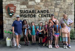 Girl Scouts of America Troop 40321 prepares to conduct a litter cleanup. The troop is one of many groups that travel to the park for volunteer projects each year. Photo courtesy of National Park Service. 