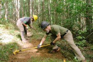 Volunteers use hand tools to improve a section of the nearly 900 miles of trail within Great Smoky Mountains National Park. Photo courtesy of National Park Service. 