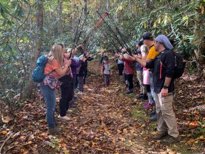 Landon Stewart leads the way through a celebratory hiker tunnel at the end of a record-setting day. Photo by Nancy East.