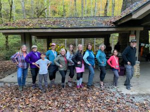 Landon, Jennifer, and E. C. celebrate their Smokies 900 YKT with eight other hikers who have completed every trail in GSMNP, including Korrin Bishop (author) and FKT recordholder Nancy East. Courtesy of Korrin Bishop.