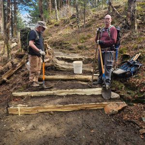 Smoky Mountains Hiking Club volunteers Rick Waggener (left) and Brian Woods install new steps near Icewater Spring. Photo by Franklin LaFond.