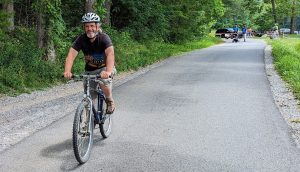 Former Steve Kemp Writer in Residence Brian Railsback pedals Cades Cove Loop Road during a summer Wednesday when cars aren't allowed. Photo courtesy of Brian Railsback.