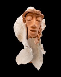 Depicting the Cherokee ‘corn mother’ Selu in a corn husk wrap, this effigy sculpture was made with kiln-fired clay by Didanisisgi Gadagwatli student Malia Crowe Skulski. Photo courtesy of the Museum of the Cherokee People. 