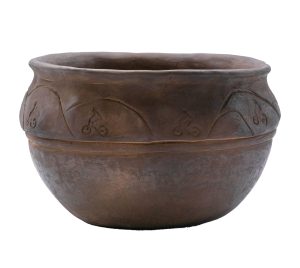 This smoke-fired pot features designs showing mountains and a woman on a bike, which artist Annette Saunooke Clapsaddle of the Eastern Band of Cherokee Indians imprinted using her personal bracelet. Photo courtesy of the Museum of the Cherokee People. 