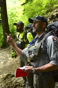 Supervisory PSAR Ranger Joshua Albritton speaks with a group of hikers descending the trail from Mount Le Conte. Photo by Holly Kays, courtesy of Smokies Life.