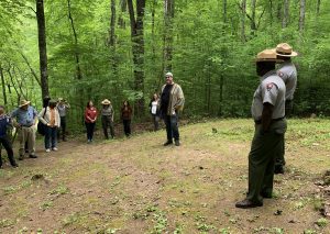 Eric Mingus, the great-grandson of Daniel Mingus, a Black man who was once enslaved on the Mingus property and continued to live there as a free man following the Civil War, visits Enloe Cemetery in 2023. Photo courtesy of Smokies Life.