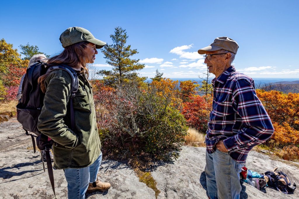Dan Pittillo, a founding member of the Blue Ridge Bartram Trail Conservancy, enjoys the view from Scaly Mountain during a 2023 hiking trip led by the organization. Photo courtesy of the Blue Ridge Bartram Trail Conservancy.