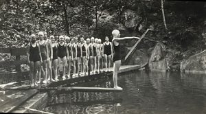 In a 1933 photo, Girl Scouts at Camp Margaret Townsend learn to dive in a pool made from a dammed-up tributary to the Little River. Photo courtesy of Girl Scout Museum at Daisy’s Place. 