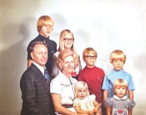 Posed family photo from 1974 of a father and mother and six children.