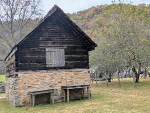 A wooden and brick barn structure