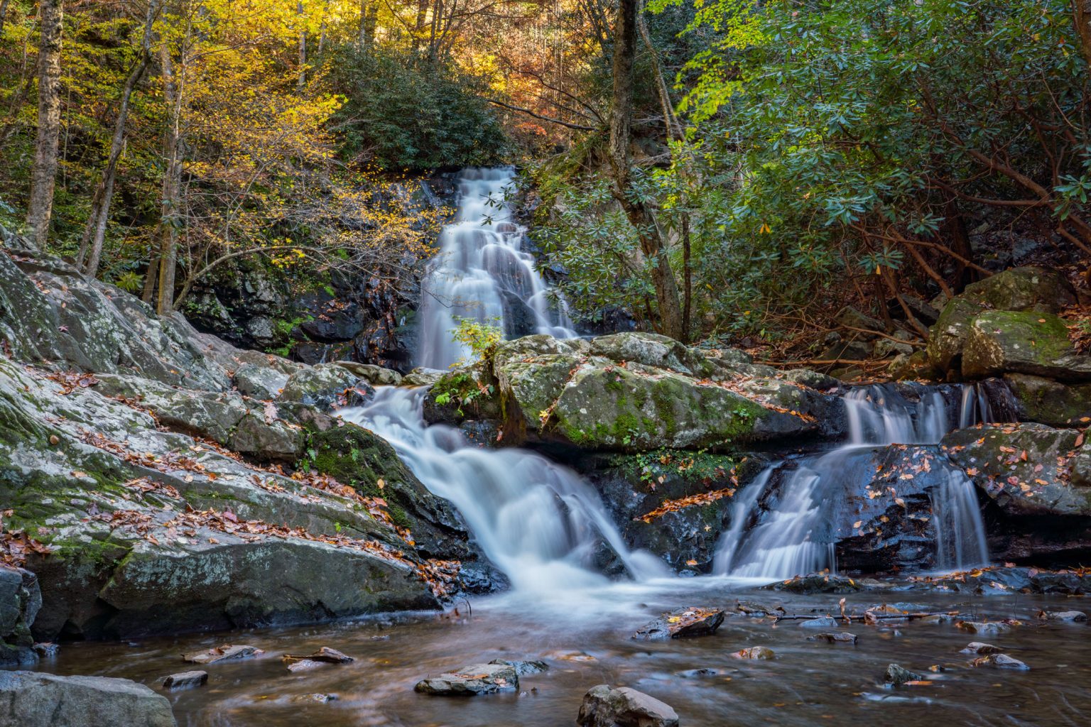 A waterfall cascades over rocks