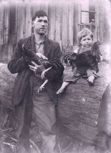Black and white photo from the 30s of a manand a child